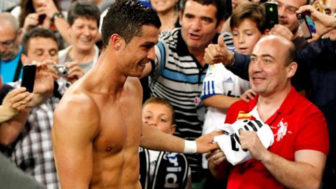 Cristiano Ronaldo gifting his shirt to a fan after a game for Real Madrid