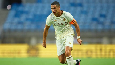 Cristiano Ronaldo playing for Al Nassr in white uniform