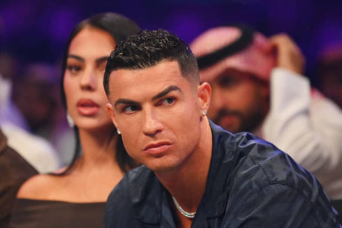 Cristiano Ronaldo next to Georgina Rodriguez attending a boxing event