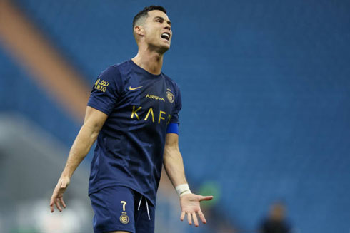 Cristiano Ronaldo playing for Al Nassr in a blue uniform