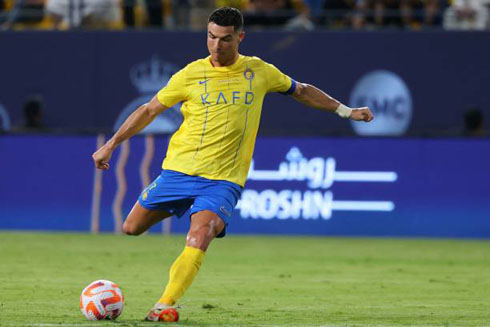 Cristiano Ronaldo kicking the ball in Al Nassr game