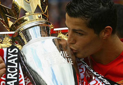 Cristiano Ronaldo kissing the Premier League trophy