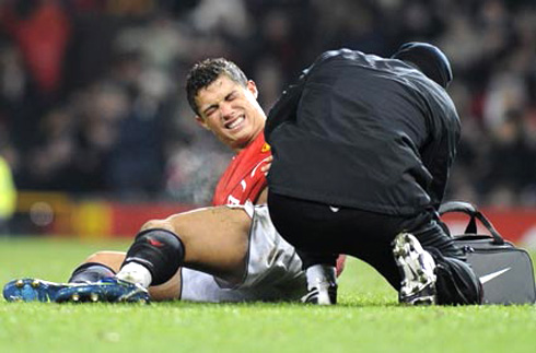 Cristiano Ronaldo down in pain after suffering an injury in Manchester United