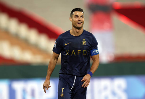 Cristiano Ronaldo in action for Al Nassr in a blue uniform