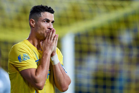 Cristiano Ronaldo praying during a football game