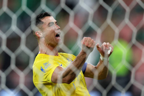 Cristiano Ronaldo celebrates behind the net for Al Nassr