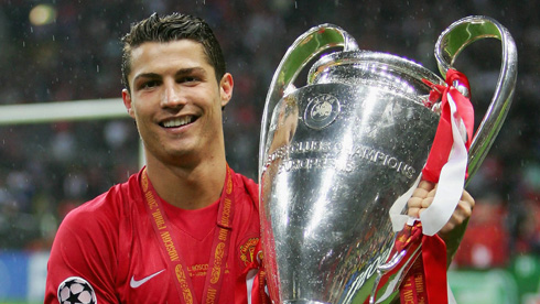 Cristiano Ronaldo holding on to the Champions League trophy at Man United