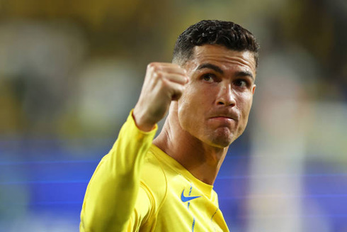 Cristiano Ronaldo making a strength gesture in Al Nassr
