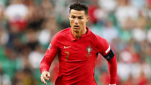 Cristiano Ronaldo playing for Portugal in a red shirt