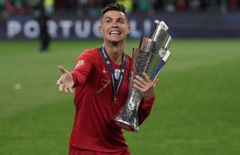 Cristiano Ronaldo happy holding another trophy for Portugal