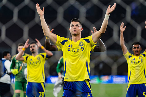 Cristiano Ronaldo cheering with fans in Al Nassr