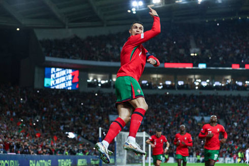 Cristiano Ronaldo jumping and celebrating his goal for Portugal in 2025
