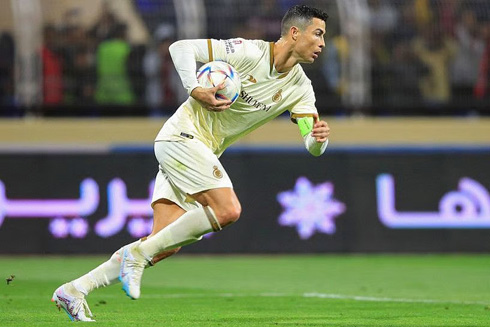 Cristiano Ronaldo taking the ball back to the centre of the field