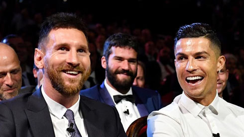 Cristiano Ronaldo laughing next to Lionel Messi