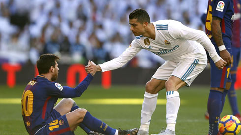 Cristiano Ronaldo helping Messi to stand up in Barça vs Real Madrid