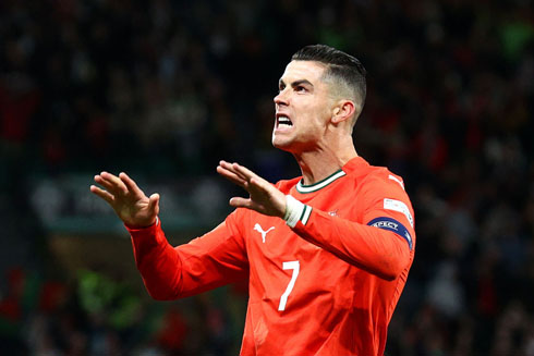 Cristiano Ronaldo gestures for fans to calm down