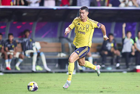 Cristiano Ronaldo running with the ball forward