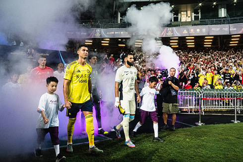 Cristiano Ronaldo entering the pitch side by side with Benzema