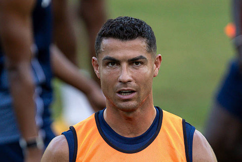 Cristiano Ronaldo wearing an orange training vest