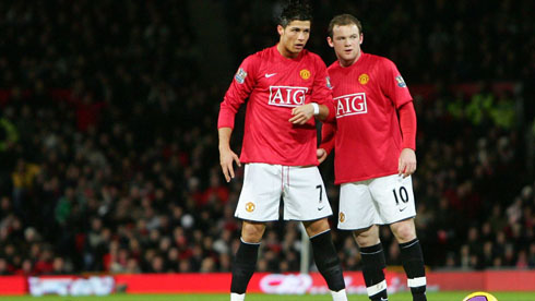 Cristiano Ronaldo talking to Rooney in game