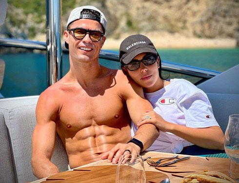 Cristiano Ronaldo showing off muscles next to Georgina Rodriguez