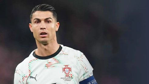 Cristiano Ronaldo playing for Portugal in a white jersey