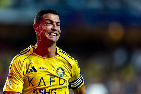 Cristiano Ronaldo running with a smile on his face