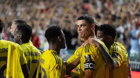 Cristiano Ronaldo surrounded by Al Nassr teammates