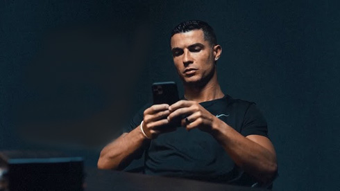 Cristiano Ronaldo with his phone in his hands