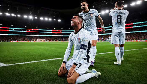 Cristiano Ronaldo on his knees after scoring for Portugal