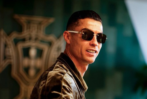 Cristiano Ronaldo in front of Portugal badge