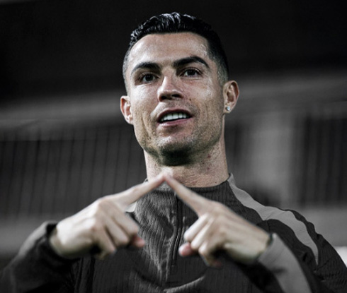 Cristiano Ronaldo touching two fingers for the photo