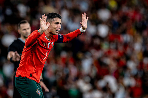 Cristiano Ronaldo raising his amrs claiming innocence