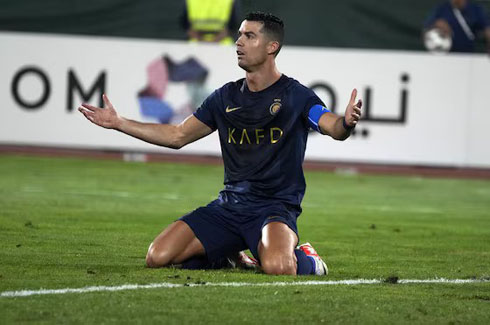 Cristiano Ronaldo on his knees blue shirt