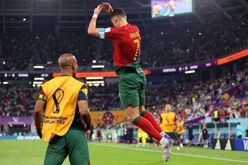 Cristiano Ronaldo jumps to perform his iconic celebration