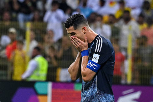 Cristiano Ronaldo covering his face in shame