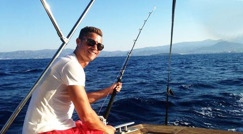 Cristiano Ronaldo fishing on a boat