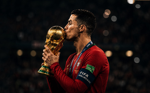 Cristiano Ronaldo kissing the World Cup trophy