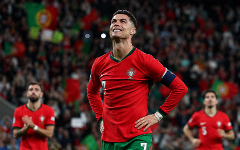 Cristiano Ronaldo with his hands on his waist while playing for Portugal