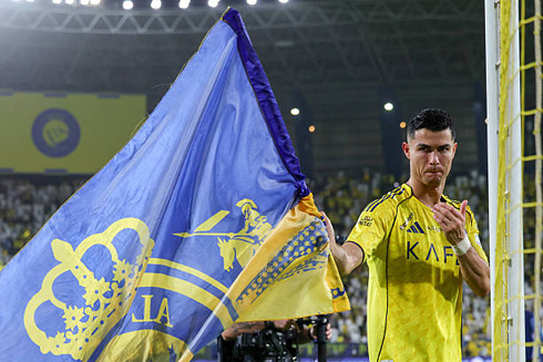 Cristiano Ronaldo and Al Nassr flag