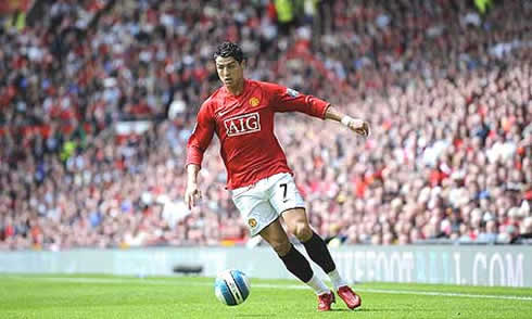 Cristiano Ronaldo playing for Manchester United at the Old Trafford