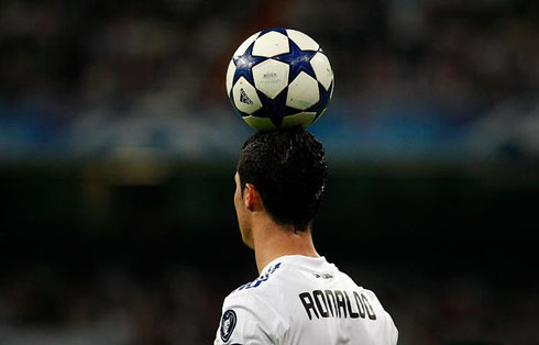 Cristiano Ronaldo holding the ball on his head