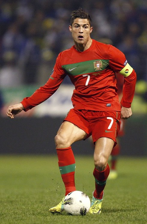 Cristiano Ronaldo passing the ball in EURO 2012 playoff against Bosnia