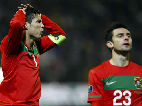Cristiano Ronaldo looking frustrated with a miss, with Hélder Postiga near him
