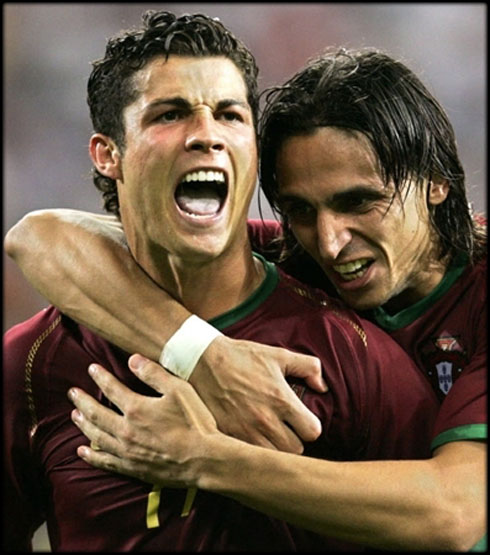 Cristiano Ronaldo playing for Portugal and being held by Fernando Meira