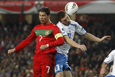 Cristiano Ronaldo jumping with Edin Dzeko in Portugal vs Bosnia, in the EURO 2012 playoff match