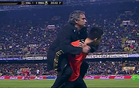 José Mourinho funny celebration after Cristiano Ronaldo scores against Valencia, by jumping to Jose Callejón back