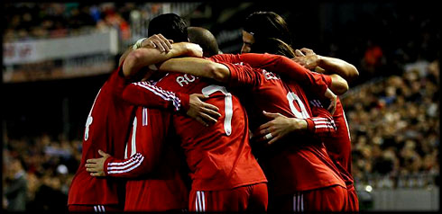 Cristiano Ronaldo in a Real Madrid team players hug against Valencia, in La Liga 2011-2012