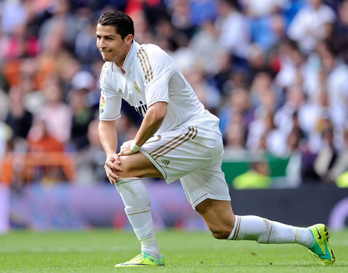 Cristiano Ronaldo standing up in a Real Madrid match, using gel on his hair