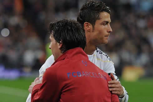 Cristiano Ronaldo and Lionel Messi, saluting and greeting each other with a hug, before a Barcelona and Real Madrid game